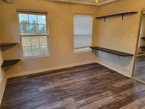 5728 Rockhill Rd, Fort Worth, TX 76112 - spacious closet featuring wood finished floors