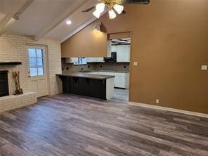 5728 Rockhill Rd, Fort Worth, TX 76112 - unfurnished living room with wood finished floors, ceiling fan, a fireplace, and baseboards