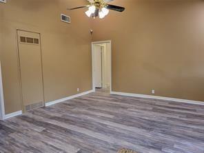 5728 Rockhill Rd, Fort Worth, TX 76112 - unfurnished room featuring ceiling fan, wood finished floors, and baseboards