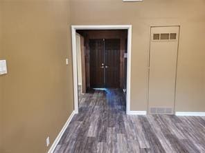 5728 Rockhill Rd, Fort Worth, TX 76112 - hall with baseboards and dark wood-style floors