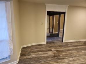 5728 Rockhill Rd, Fort Worth, TX 76112 - spare room featuring wood finished floors and baseboards