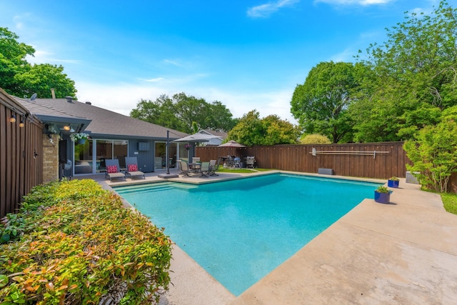 15732 Nedra Way, Dallas, TX 75248 - view of swimming pool featuring a patio area and a fenced backyard