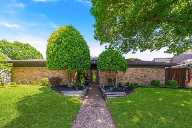 15732 Nedra Way, Dallas, TX 75248 - view of front of property with brick siding and a front yard