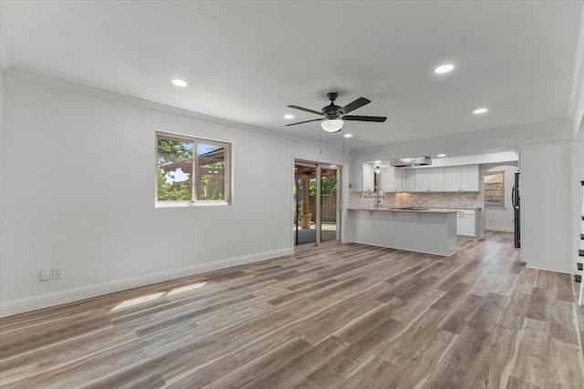 11230 Cotillion Dr, Dallas, TX 75228 - unfurnished living room featuring recessed lighting, crown molding, a ceiling fan, light wood-style floors, and baseboards