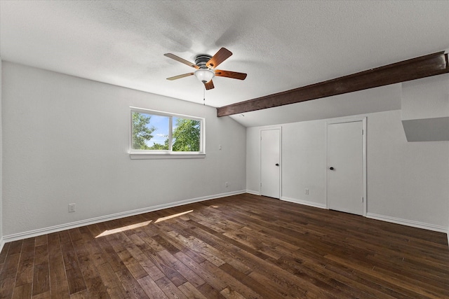 11230 Cotillion Dr, Dallas, TX 75228 - unfurnished bedroom with a textured ceiling, dark wood-style flooring, and baseboards