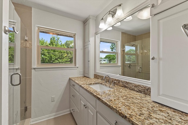 11230 Cotillion Dr, Dallas, TX 75228 - full bathroom featuring healthy amount of natural light, a stall shower, and vanity