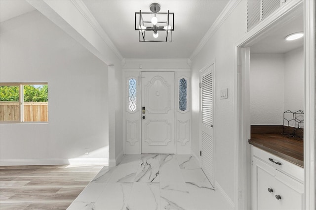 11230 Cotillion Dr, Dallas, TX 75228 - entryway featuring baseboards, ornamental molding, and a chandelier