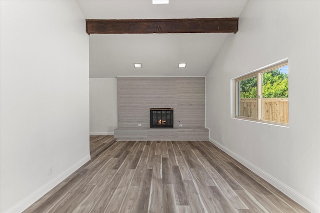 11230 Cotillion Dr, Dallas, TX 75228 - unfurnished living room featuring a glass covered fireplace, wood finished floors, and baseboards