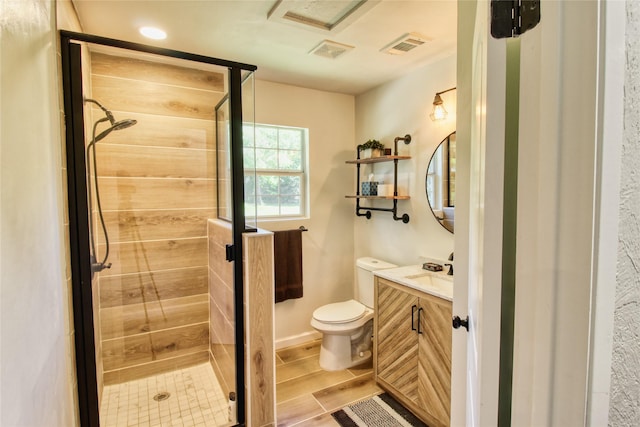 505 E 4th St, Weatherford, TX 76086 - full bath with vanity, a stall shower, and wood finished floors