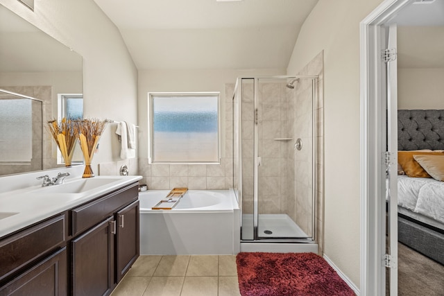3010 Rosemount Ln, Forney, TX 75126 - ensuite bathroom with lofted ceiling, a shower stall, tile patterned flooring, a bath, and double vanity