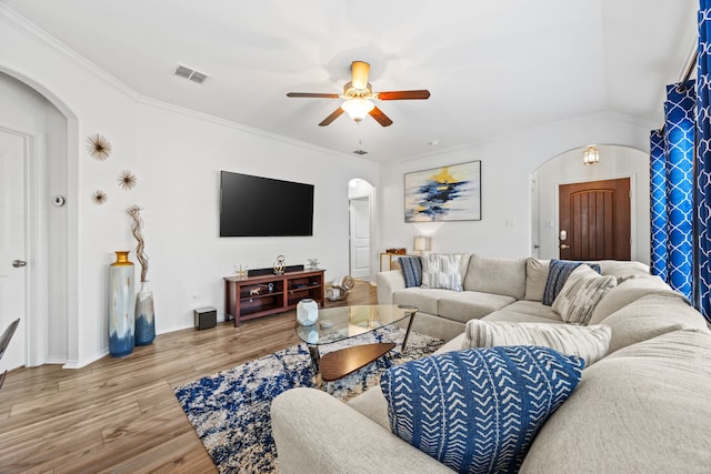 3010 Rosemount Ln, Forney, TX 75126 - living area featuring arched walkways, a ceiling fan, wood finished floors, ornamental molding, and baseboards
