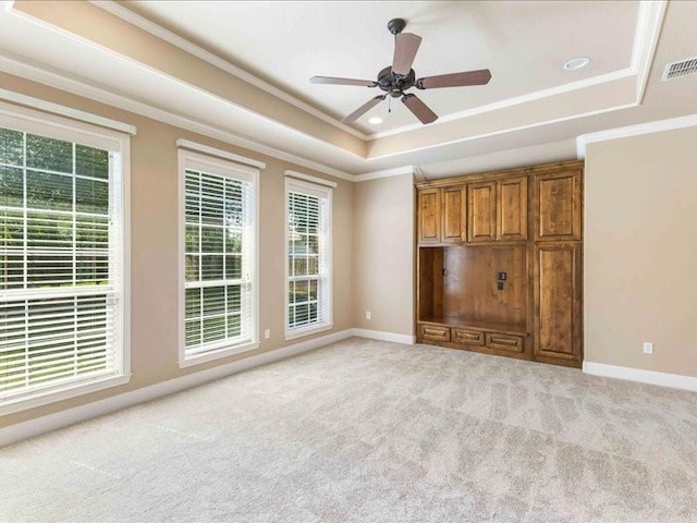 113 Winding Creek Ln, Waco, TX 76657 - unfurnished bedroom featuring a raised ceiling, ornamental molding, carpet, baseboards, and ceiling fan