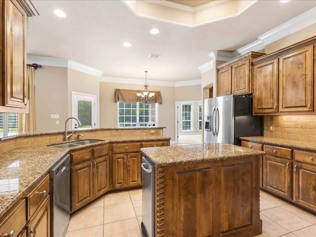 113 Winding Creek Ln, Waco, TX 76657 - kitchen featuring a sink, stainless steel appliances, light tile patterned floors, crown molding, and healthy amount of natural light