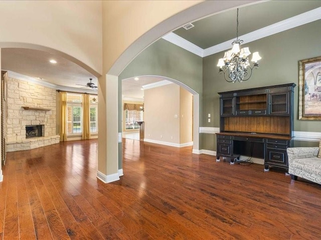 113 Winding Creek Ln, Waco, TX 76657 - unfurnished living room with ornamental molding, wood finished floors, ceiling fan, a stone fireplace, and baseboards