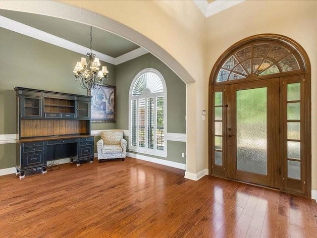 113 Winding Creek Ln, Waco, TX 76657 - foyer with wood finished floors, baseboards, crown molding, a chandelier, and arched walkways