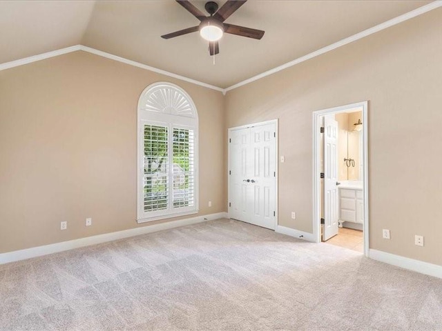 113 Winding Creek Ln, Waco, TX 76657 - unfurnished bedroom featuring light colored carpet, ornamental molding, baseboards, lofted ceiling, and ensuite bathroom