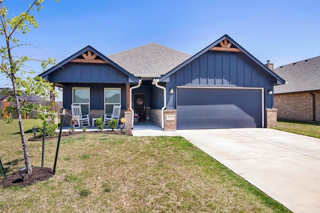 2113 Ajay Dr, Sherman, TX 75092 - craftsman house with board and batten siding, a garage, a front yard, and concrete driveway