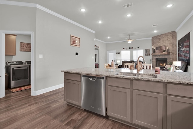 2113 Ajay Dr, Sherman, TX 75092 - kitchen with stainless steel dishwasher, a sink, ornamental molding, a fireplace, and open floor plan