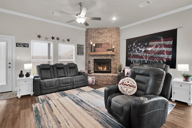 2113 Ajay Dr, Sherman, TX 75092 - living room featuring crown molding, ceiling fan, wood finished floors, and a brick fireplace