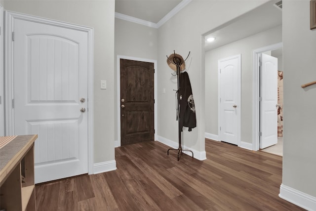 2113 Ajay Dr, Sherman, TX 75092 - foyer featuring dark wood-style floors, crown molding, and baseboards