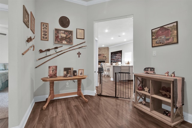 2113 Ajay Dr, Sherman, TX 75092 - entrance foyer with crown molding, wood finished floors, a fireplace, baseboards, and recessed lighting