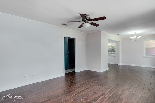 unfurnished room with a chandelier, dark wood-type flooring, ceiling fan, baseboards, and ornamental molding