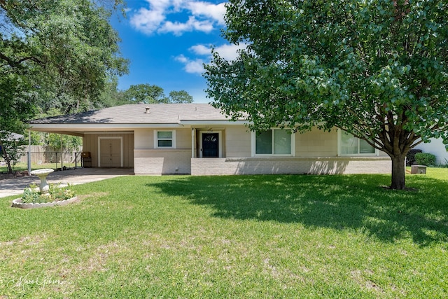 view of front of house with brick siding, an attached carport, and concrete driveway