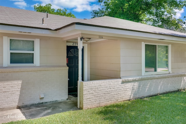 view of side of property with brick siding