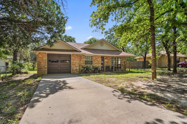 816 Red Oak Ct, Azle, TX 76020 - ranch-style house with brick siding, concrete driveway, fence, and a garage
