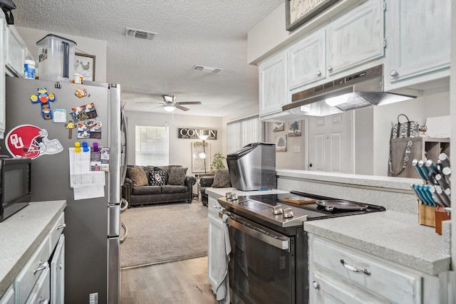816 Red Oak Ct, Azle, TX 76020 - kitchen with appliances with stainless steel finishes, under cabinet range hood, ceiling fan, open floor plan, and a textured ceiling