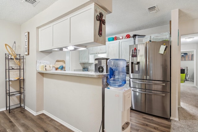 816 Red Oak Ct, Azle, TX 76020 - kitchen with stainless steel fridge, a textured ceiling, dark wood-type flooring, light countertops, and baseboards