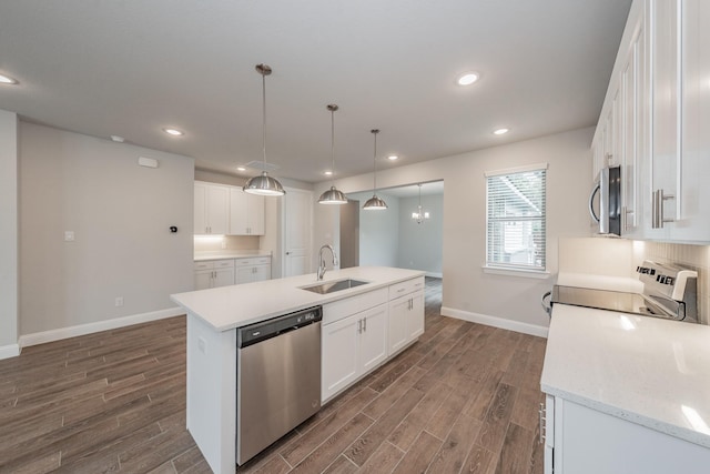 9553 Thorncrown Ln, Fort Worth, TX 76179 - kitchen with appliances with stainless steel finishes, a sink, baseboards, dark wood finished floors, and recessed lighting