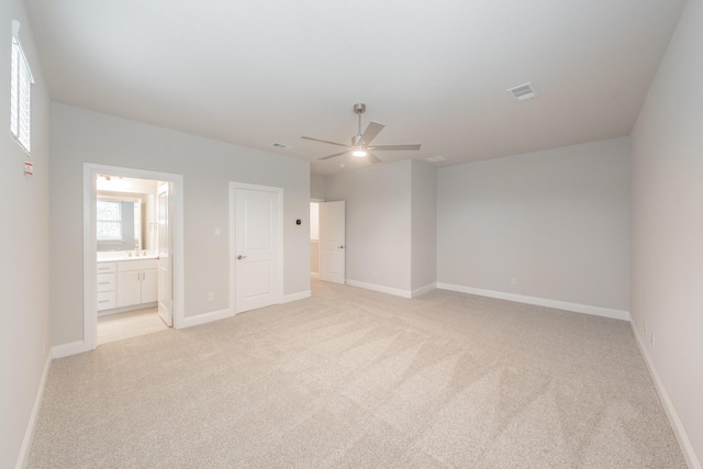 9553 Thorncrown Ln, Fort Worth, TX 76179 - empty room with light carpet, a ceiling fan, baseboards, and plenty of natural light