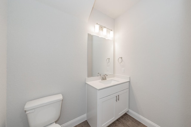 9553 Thorncrown Ln, Fort Worth, TX 76179 - half bath featuring wood finished floors, toilet, vanity, and baseboards