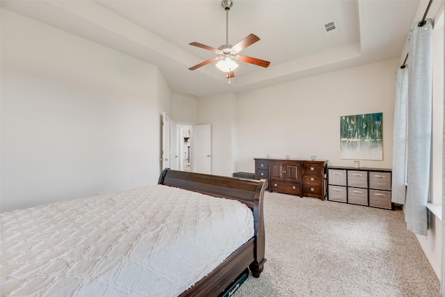 6920 Humboldt Pl, Mckinney, TX 75070 - carpeted bedroom featuring a tray ceiling and a ceiling fan