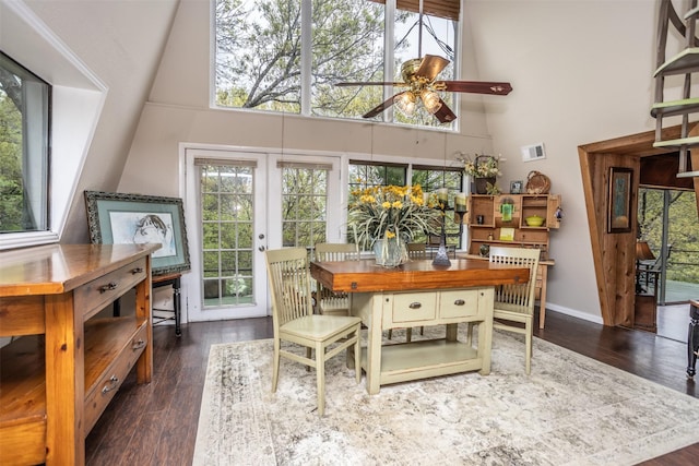 1867 Chaparral Dr, Gainesville, TX 76240 - dining space featuring a towering ceiling, a ceiling fan, healthy amount of natural light, and dark wood-style flooring