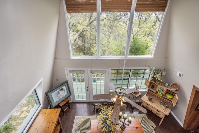 1867 Chaparral Dr, Gainesville, TX 76240 - living room with wood finished floors, healthy amount of natural light, a towering ceiling, and a ceiling fan