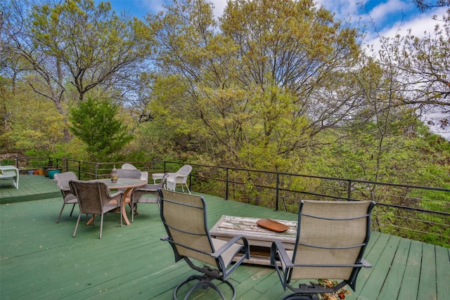 1867 Chaparral Dr, Gainesville, TX 76240 - wooden deck featuring outdoor dining space
