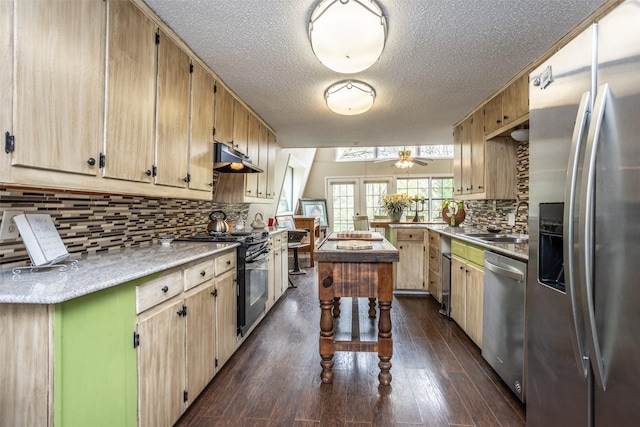 1867 Chaparral Dr, Gainesville, TX 76240 - kitchen with stainless steel appliances, ceiling fan, light countertops, tasteful backsplash, and a textured ceiling