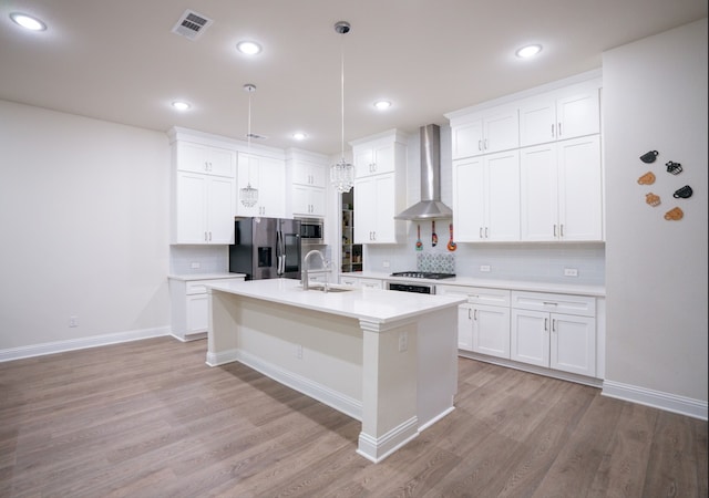 4569 Wilbarger St, Plano, TX 75024 - kitchen with wall chimney exhaust hood, stainless steel appliances, a sink, light wood-type flooring, and recessed lighting