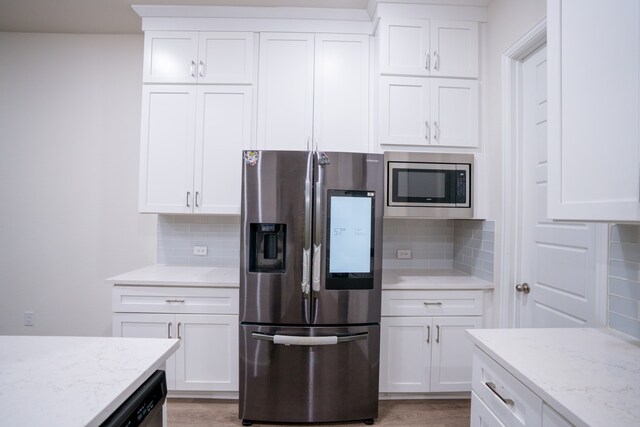 4569 Wilbarger St, Plano, TX 75024 - kitchen with stainless steel appliances, decorative backsplash, and white cabinets