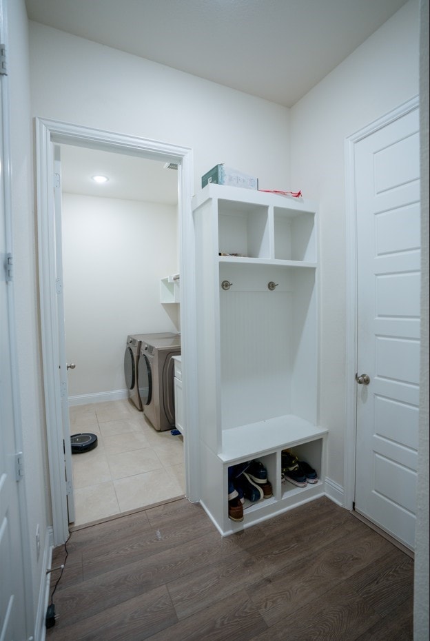 4569 Wilbarger St, Plano, TX 75024 - mudroom featuring washing machine and clothes dryer and wood finished floors
