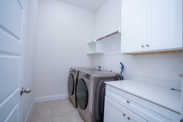 4569 Wilbarger St, Plano, TX 75024 - laundry area with washer and dryer, cabinet space, light tile patterned flooring, and baseboards