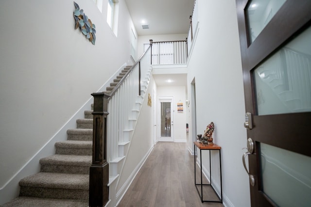 4569 Wilbarger St, Plano, TX 75024 - foyer with stairway, wood finished floors, a high ceiling, and baseboards