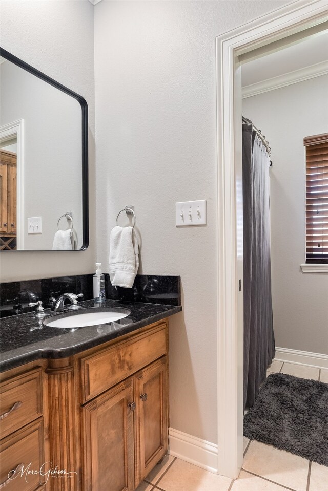2228 Grapevine Ln, Haughton, LA 71037 - bathroom featuring tile patterned floors, vanity, crown molding, baseboards, and curtained shower