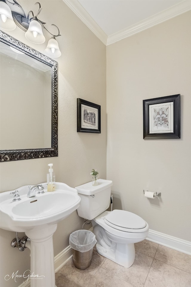 2228 Grapevine Ln, Haughton, LA 71037 - half bathroom featuring baseboards, crown molding, toilet, and tile patterned floors
