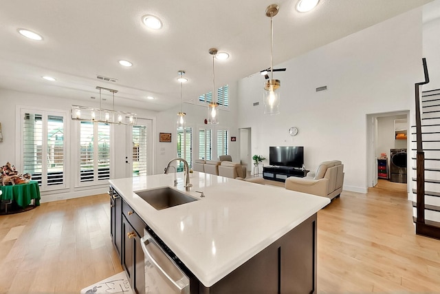 3932 Linear, Celina, TX 75078 - kitchen with a sink, stainless steel dishwasher, light wood-style floors, light countertops, and recessed lighting