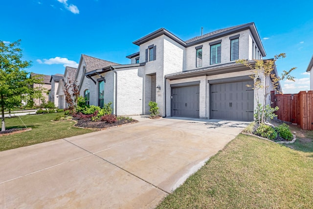 3932 Linear, Celina, TX 75078 - view of front of house featuring an attached garage, driveway, stucco siding, and brick siding