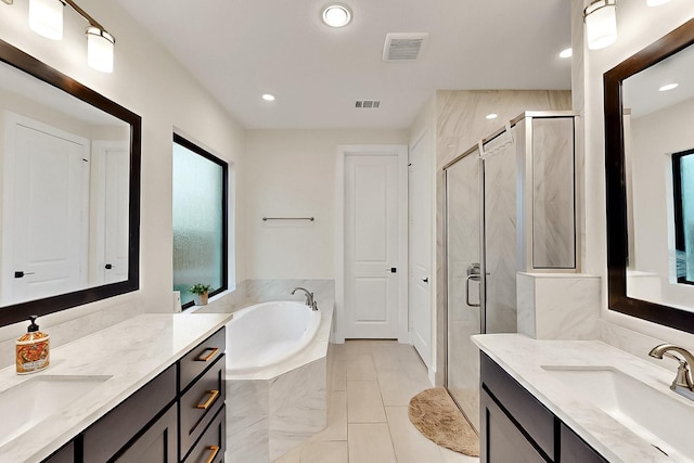 3932 Linear, Celina, TX 75078 - full bath with a stall shower, a garden tub, two vanities, recessed lighting, and tile patterned floors