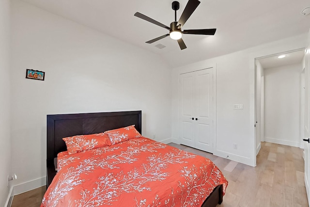 3932 Linear, Celina, TX 75078 - bedroom featuring wood finished floors, lofted ceiling, baseboards, and a closet